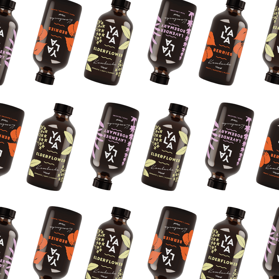 YALA kombucha bottles in Berries, Elderflower, and Lavender & Rosemary flavours arranged on white background